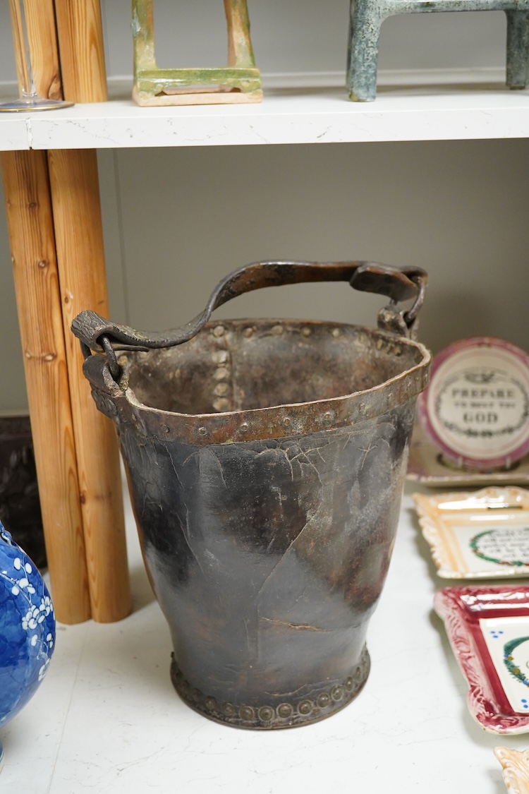 A 19th century leather fire bucket, 34cm high